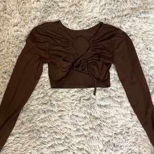 I am selling this pretty brown long sleeve crop top with a strap back size M❤️